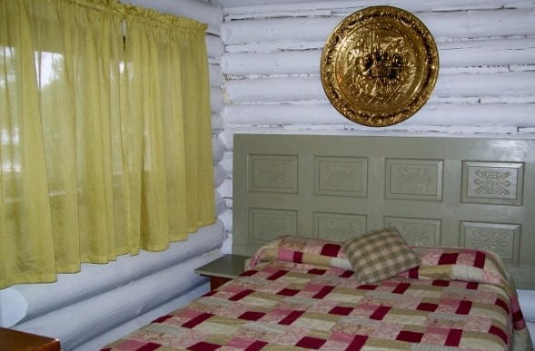 Cabin bedroom with double bed.