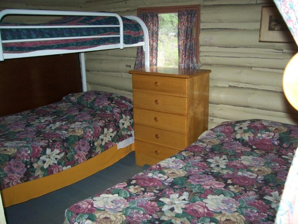 Cabin 1 bedroom with bunkbed and twin bed.